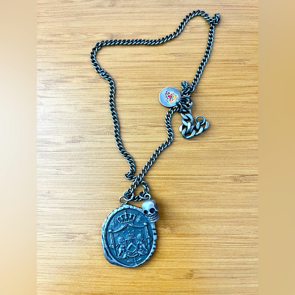 Juicy Couture medallion necklace with skull.